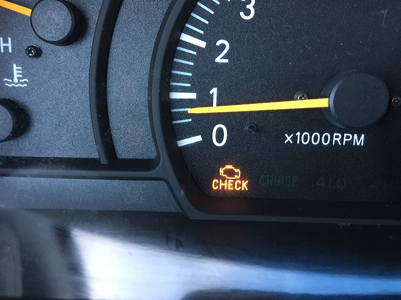 A tachometer with check engine light in the bottom corner